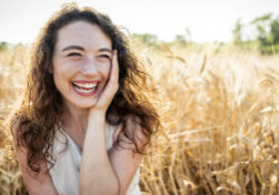 happy beautiful woman smiling in a wheat field delightful fema